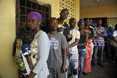 People wait to cast their votes during a Presidential runoff election in Monrovia, Liberia, Tuesday Dec. 26, 2017. | AP