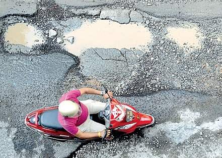 Killer potholes of Bengaluru. (Express Photo Service)