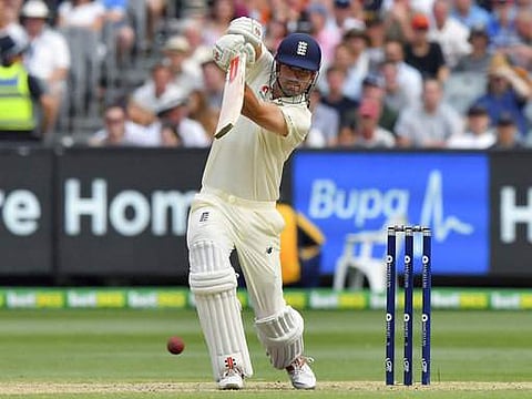England's Alastair Cook drives the ball against Australia during the third day of their Ashes cricket test match in Melbourne, Australia. | AP
