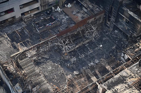 A view of the charred building in which a fire broke out in Mumbai on early Friday. At least 14 people were killed and as many injured after a major fire in Kamala Mills Compound in Lower Parel. | PTI
