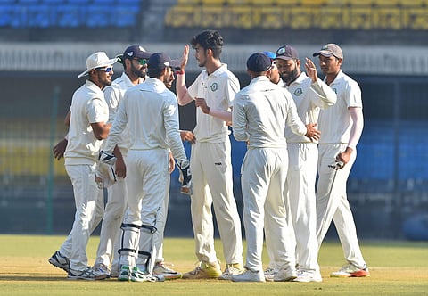 Vidarbha bowler Aditya Thakare celebrates with his teammates after dismissing Delhi batsman K Chandela during the Ranji Trophy final cricket match between Delhi and Vidarbha in Indore on Friday. | PTI