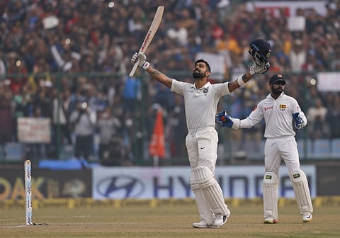 India's captain Virat Kohli celebrates after scoring a double century during the second day of their third Test match against Sri Lanka in New Delhi, India, Sunday, Dec. 3, 2017. | AP
