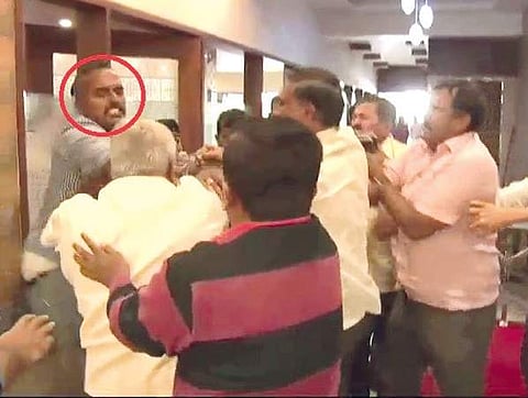 A video grab of a TV journalist being attacked by BJP workers in Tumakuru on Saturday | Express