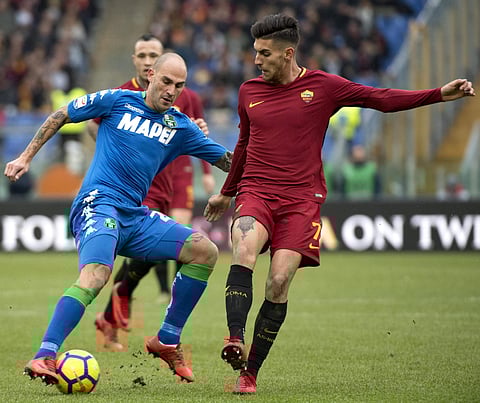 Sassuolo's Paolo Cannavaro (L)  and Roma's Lorenzo Pellegrini vie for the ball | AP