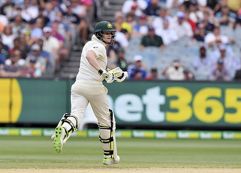 Australia's Steve Smith runs to bring up his 100 runs against England during the fifth day of their Ashes test match in Melbourne, Australia, Saturday, Dec. 30, 2017. | AP