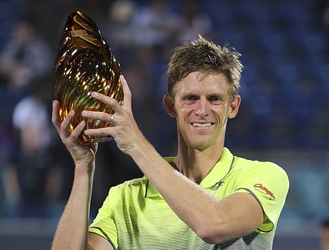 Kevin Anderson holds the trophy after he beats Roberto Bautista Agut at the final match of the Mubadala World Tennis Championship in Abu Dhabi. | AP