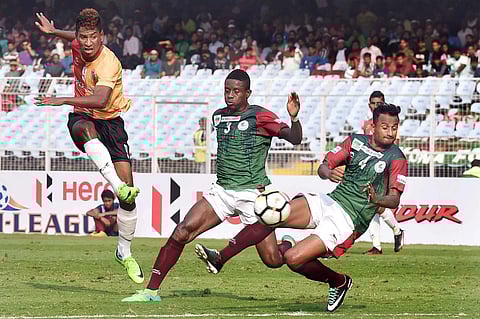 East Bengal player Willis Deon Plaza and Mohun Bagan's KingSley Obumneme and Kinshuk Debnath in action during their I-League Derby match at Salt Lake in Kolkata on Sunday. | PTI