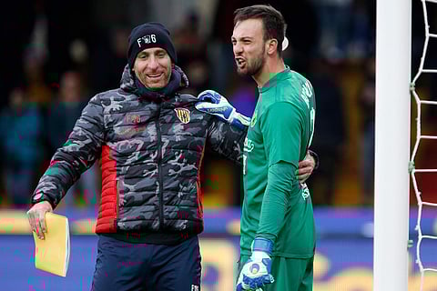Benevento goalkeeper Alberto Brignoli, right, is cheered by a team member after scoring the equalizer at the end of the Italian Serie A soccer match between Benevento and AC Milan in Benevento, Italy, Sunday, Dec. 3, 2017. | AP