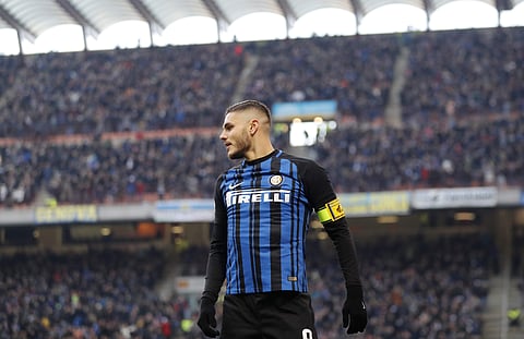 Inter Milan's Mauro Icardi celebrates after scoring during the Serie A soccer match between Inter Milan and Chievo Verona at the San Siro stadium in Milan, Italy, Sunday, Dec. 3, 2017. | AP