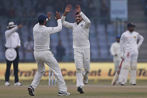 India's Ravindra Jadeja celebrates with  Cheteshwar Pujara the wicket of Sri Lanka's Dimuth Karunaratne | AP