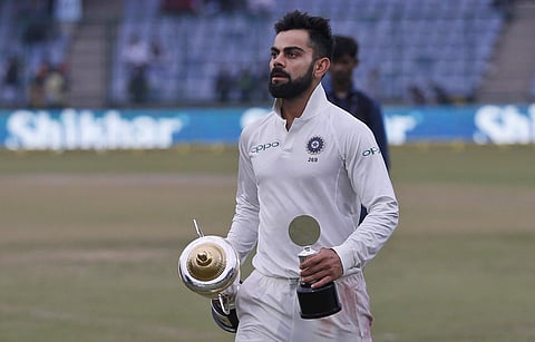 India's captain Virat Kohli holds the trophy at the end of third test | AP