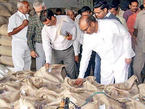 Minister P Pulla Rao inspecting rice bags at a rice mill  in Penugonda mandal on Tuesday | Express