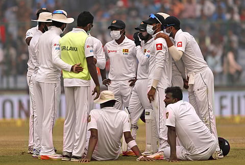 Sri Lanka's players wearing anti-pollution masks during the second day of their third Test match in New Delhi. (Photo | AP)