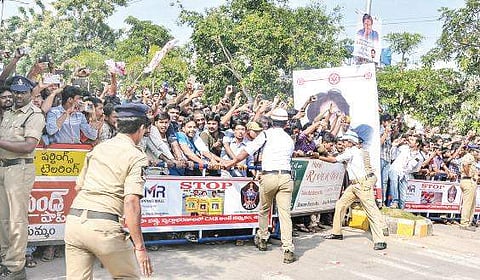 Police erect barricades to prevent surging fans of Jana Sena chief Pawan Kalyan on a busy road in Rajamahendravaram on Thursday | Express