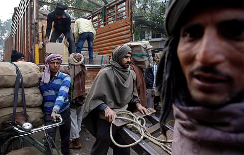 Porters move goods in the Chandni Chowk area of Old Delhi, India February 1, 2017. | Reuters