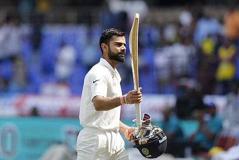 Virat Kohli raises his bat to acknowledge the applause from the crowd as he leaves the ground after losing his wicket during the second day of the cricket test match against Bangladesh in Hyderabad on February 10. (Photo | AP)
