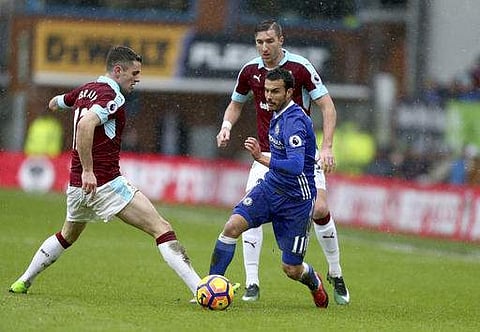 Chelsea's Pedro, right, competes for the ball with Burnley's Robbie Brady, left, during the English Premier League soccer match between Burnley and Chelsea at Turf Moor stadium in Burnley, England, Sunday, Feb. 12, 2017. (Photo | AP)