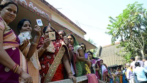 Voters queue up at the booth in Kesura gram panchayat on the outskirts of Bhubaneswar.