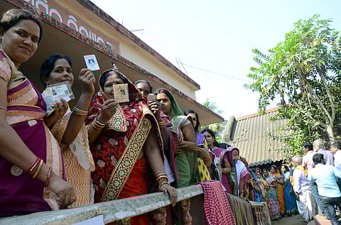 Voters queuing up at the booth in Kesura gram panchayat on the outskirts of Bhubaneswar on Monday as the State went to polls for the first phase of panchayat elections.(Biswanath Swain |EPS)