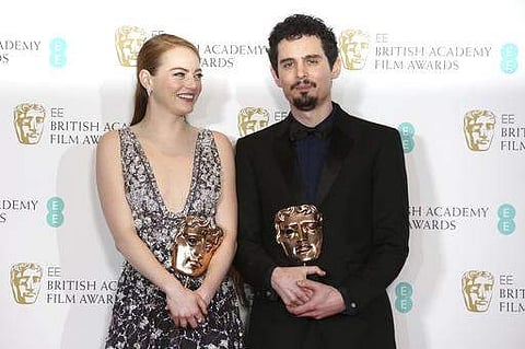 Actress Emma Stone with her BAFTA award for Best Actress and director Damien Chazelle with his BAFTA award for Best Director both for the film 'La La Land' . (AP)