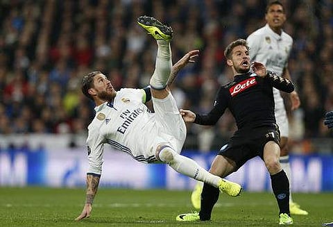 Napoli's Dries Mertens fights for the ball against Real Madrid's Sergio Ramos during the Champions League round of 16, first leg, soccer match between Real Madrid and Napoli. | AP