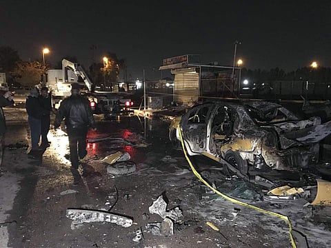 Iraqi security forces gather at the site of a suicide car bomb attack in the eastern Habibiya neighborhood of Baghdad, Iraq, Wednesday, Feb. 15, 2017. (Photo | AP)