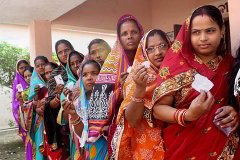 oters wait in a queue to exercise their franchise during the 3rd phase of Odisha’s Panchayat election in Kantapada village in Cuttack on Friday.(Photo | PTI)