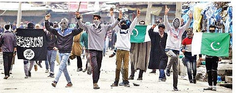 Youngsters protesting at Nowhatta in downtown Srinagar, waving ISIS and Pakistani flags and raising anti-India, pro-Pakistan slogans on Friday, after congregational prayers | Sami Ullaha