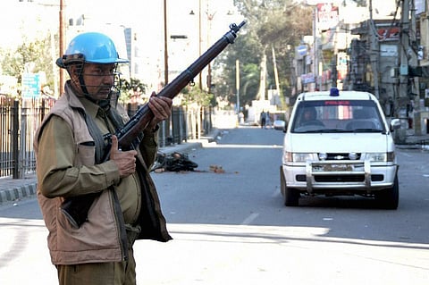 A security personnel stands guard on account of the ongoing Jat protests demanding reservation in Rohtak. | PTI File Photo