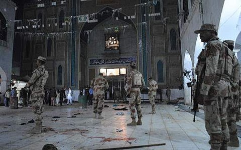 Pakistani para-military soldiers stand alert after a deadly suicide attack at the shrine of famous Sufi Lal Shahbaz Qalandar in Sehwan, Pakistan. (File photo | AP)