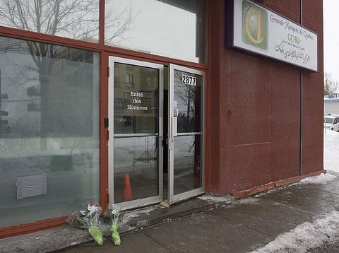 Flowers lay at the men's entrance of the mosque on Wednesday, February 1, 2017 in Quebec City, Canada. | AP
