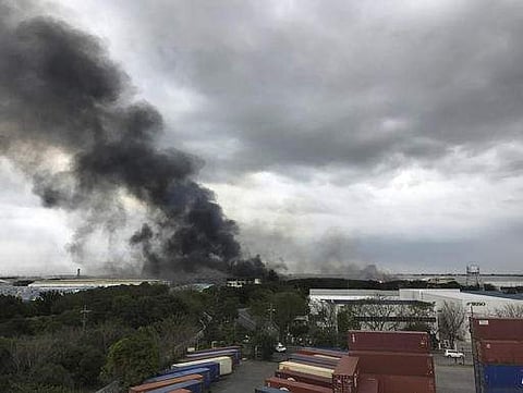Smoke rises from a factory compound, Thursday, Feb. 2, 2017, in General Trias town in Cavite province, south of Manila, Philippines. AP