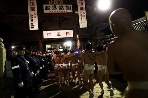 Worshippers arrive at Saidaiji Temple to attend the annual Naked Man Festival or 'Hadaka Matsuri' in Okayama, western Japan. (AFP)