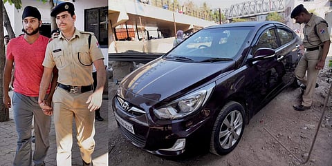 Police take into custody Harmeet Singh for driving onto the platform of Andheri station in Mumbai on Monday. (PTI)