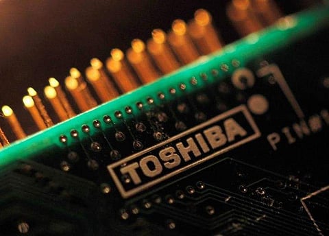 A logo of Toshiba Corp is seen on a printed circuit board in this photo illustration taken in Tokyo. | Reuters