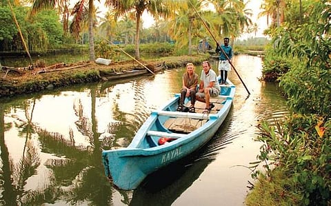 Traversing the backwaters; Kakkathuruthu island (below)