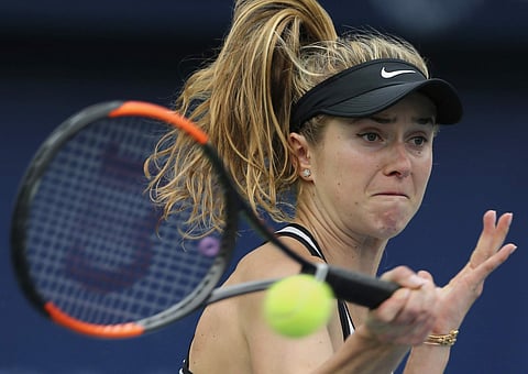 Elina Svitolina of Ukraine returns the ball to Lauren Davis of the U.S. during a quarter final match of the Dubai Tennis Championships. | AP