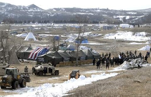 Law enforcement enters the Oceti Sakowin camp to begin arresting Dakota Access Pipeline protesters in Morton County. ( Photo | AP)