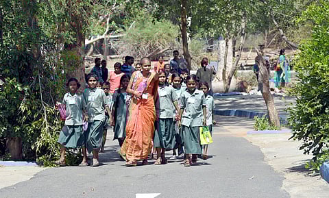 Vandalur Zoo, a popular picnic spot for school children, sees kids again as these school girls walk with their teacher for a trip to the zoo. (Martin Louis | EPS)