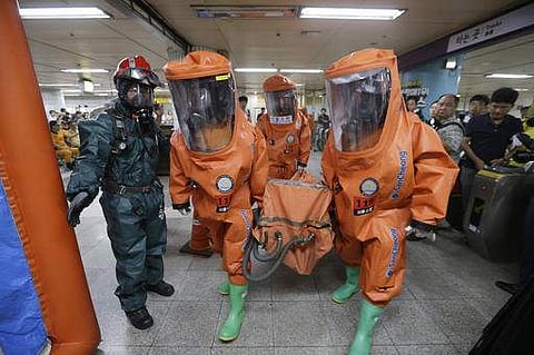 South Korean firefighters wearing protective gears move during an anti-terror drill as part of Ulchi Freedom Guardian exercise. (File photo | AP)