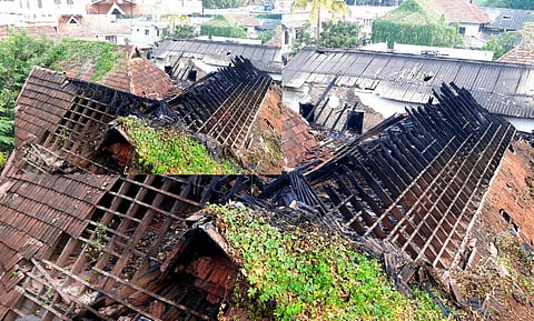Firemen dousing fire at parcel godown of post office located at the North gate of Padmanabha Swamy temple in Thiruvananthapuram on the wee hours of Sunday.(Kaviyoor Santhosh | EPS)