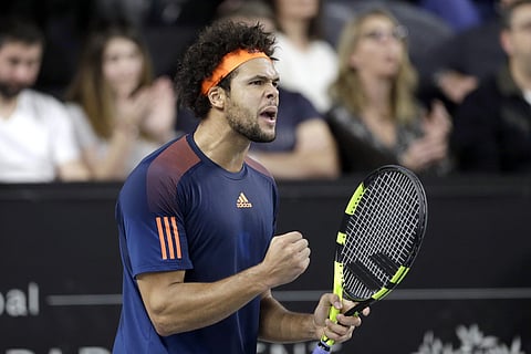 Jo-Wilfried Tsonga of France reacts after after winning a point against Lucas Pouille of France, during their final match at the Open 13 Provence tennis tournament. | AP