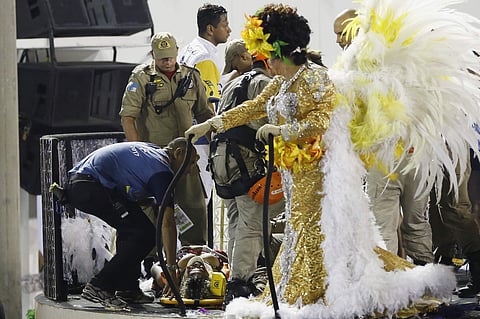 An injured person lies on a stretcher on the top of a float as she is being rescued during the performing of the Unidos da Tijuca samba school for the Carnival celebrations at the Sambadrome in Rio de Janeiro, Brazil, Tuesday, Feb. 28, 2017. (Photo | AP)