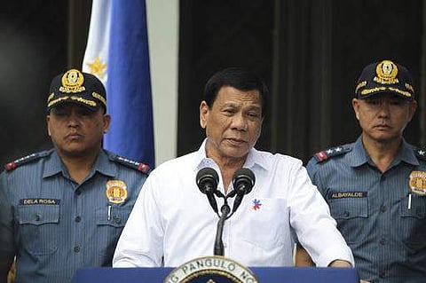 Philippine President Rodrigo Duterte, center, speaks to erring policemen during an audience at the Presidential Palace grounds in Manila, Philippines (File Photo | AP)