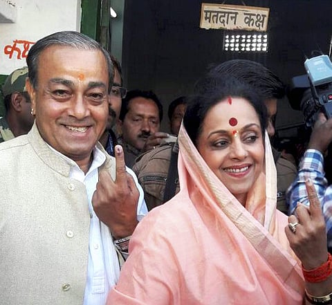 Amethi Congress candidate Amita Singh with her husband and senior party leader Sanjay Singh after casting their votes in the UP Assembly polls, in Amethi on Monday | PTI