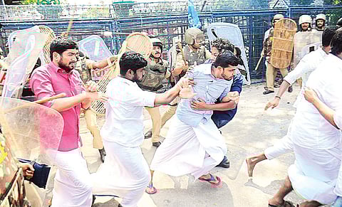 KSU activists being lathicharged by police in front of the Secretariat in Thiruvananthapuram during a protest demanding the resignation of Law Academy principal Lekshmi Nair on Thursday | B P Deepu