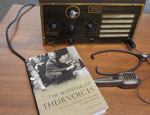 A book about David Boder's recordings of concentration camp survivors sits next to one of his wire recorders on display at the University of Akron's Center for History of Psychology. (AP)