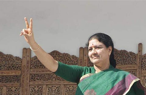 VK Sasikala who is to take over as the next chief minister of Tamil Nadu, displays the hand gesture denoting the AIADMK's two leaves symbol, wearing a green saree, a colour favoured by her predecessor J Jayalalithaa, at the party office in Chennai. ( Ashw