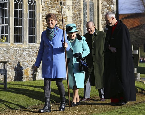 Britain's Queen Elizabeth II and her husband Duke of Edinburgh, centre, arrive at St Peter and St Paul at West Newton, England, Sunday Feb. 5, 2017. | AP