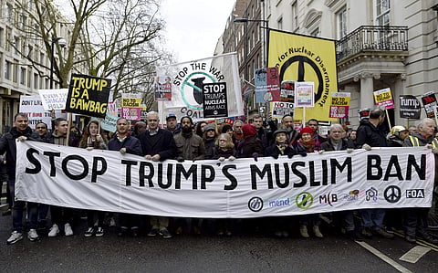 Demonstrators march to Downing Street, as they protest against US President Donald Trump's travel ban, in London.  | AP